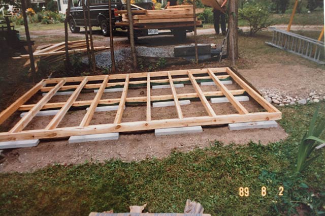 The frame for the shed is then placed on the patio stones.